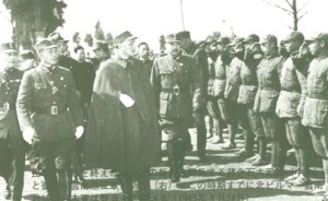 Chiang Kai Shek inspecting his straw- boots wearing soldiers - not a very golden age.